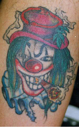 Bser Clown mit Zigarre Tattoo